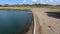 An artificial lake for fishing. A bridge for fishermen on the lake. Lake fishing.