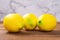 Artificial lemons on a wood table