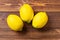 artificial lemons on a wood table
