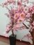 Artificial paper cherry blossoms complete with stems and branches