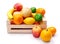 Artificial plastic fruits in wooden crate