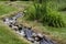 Artificial pond stream and decorative landscaped garden