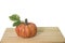 Artificial pumpkin on wooden floor