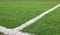 Artificial sports surface green grass imitation on the football stadium