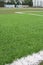Artificial sports surface green grass imitation on the football stadium
