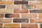 Artificial stone background pink brown rectangular shape in the form of a wall of burnt bricks. Backgrounds, textures