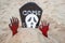 Artificial tombstone with skeleton decoration on the beach during Halloween