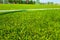 Artificial turf football pitch with white line outside vertically