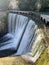 Artificial waterfall on the river Psyrtskha in the summer, the city of New Athos, Abkhazia