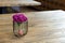Artificial wood flowerpot on wooden table, small light brown colArtificial wood flowerpot on wooden table, small light brown colou