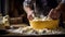 Artisan baker kneading dough with flour in yellow bowl in rustic bakery setting