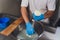 Artisan cheesemaker cuts the mozzarella with hands.