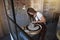 Artisan creatively shaping clay in her pottery studio