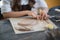 Artisan female potter prepares material for her pottery. Woman hands attach clay part to future ceramic product. Work