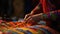 Artisan hands meticulously crafting colorful, traditional textile patterns