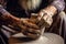 artisan hands shaping a clay vase on wheel