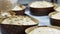 artisan italian baker preparing panettone christmas cake adding almonds to icing