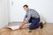 Artisan putting new flooring