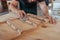 Artisan skillfully sanding a piece of wood in his workshop