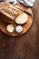 Artisan sourdough sliced toast bread with butter and pink himalayan salt on cutting board