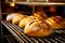 Artisanal bread loafs in cooling rack at bakery. Close-up