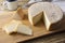 Artisanal Canastra cheese from Minas Gerais, Brazil with coffee cup over wooden table