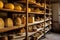artisanal cheese aging on wooden shelves
