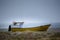 Artisanal fishing boat on the sand by the sea