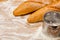 Artisanal French baguettes and flour sieve or sifter on a table