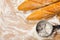 Artisanal French baguettes and flour sieve or sifter on a table