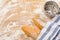 Artisanal French baguettes and flour sieve or sifter on a table