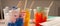 Artist acrylic colours in plastic cups in art studio