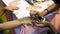 Artist applying henna tattoo on child hand