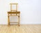 Artist easel covered in paint in a clean studio