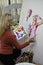 Artist in her fifties painting