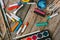 Artist paint brushes,chalks and watercolor paintbox on wooden background.Painting hobby background.Paintings art concept