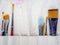Artist paint brushes. Flat lay of many artist tools in calico paint brush holder