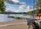 Artist painting the lake and a pier in Ambleside in Lake Windremere