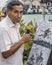 Artist painting on the street in Caracas Venezuela, portrait