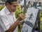 Artist painting on the street in Caracas Venezuela. Portrait.