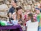 The artist paints a drawing on the girl`s face at the annual festival `Jerusalem Knights`