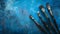 Artist\\\'s Paintbrushes on blue textured