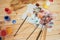 The artist\'s palette. Colored oil paints over a pallete on a table.