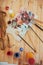 The artist\'s palette. Colored oil paints over a pallete on a table.