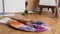 Artist\\\'s palette with mixed paints and brushes on wooden table