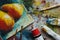 Artist studio with oil paints, brushes and colorful picture