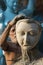 Artist working on a Head portion of  a Clay idols of hindu godess at Kumartuli,Kolkata,India