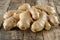 Artistic arrangement of fresh ginger displayed with care on a charming rustic wooden table