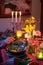 Artistic autumn tablescape: porcelain, candlelight, and diners\\\' hands