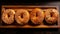 Artistic Bagel Photography: Stunning Images Of Bagels On Black Wooden Board